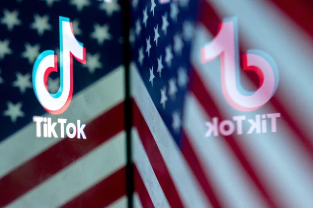 This photo illustration shows the TikTok logo reflected in an image of the US flag, in Washington, DC, on March 16, 2023. - China urged the United States to stop "unreasonably suppressing" TikTok on March 16, 2023, after Washington gave the popular video-sharing app an ultimatum to part ways with its Chinese owners or face a nationwide ban. (Stefani Reynolds/AFP via Getty Images)