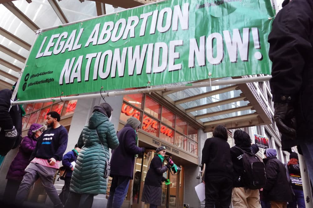 Demonstrators advocate for a woman's right to an abortion stop to protest in front of a Walgreen's store in Chicago, Illinois. (Scott Olson/Getty Images)
