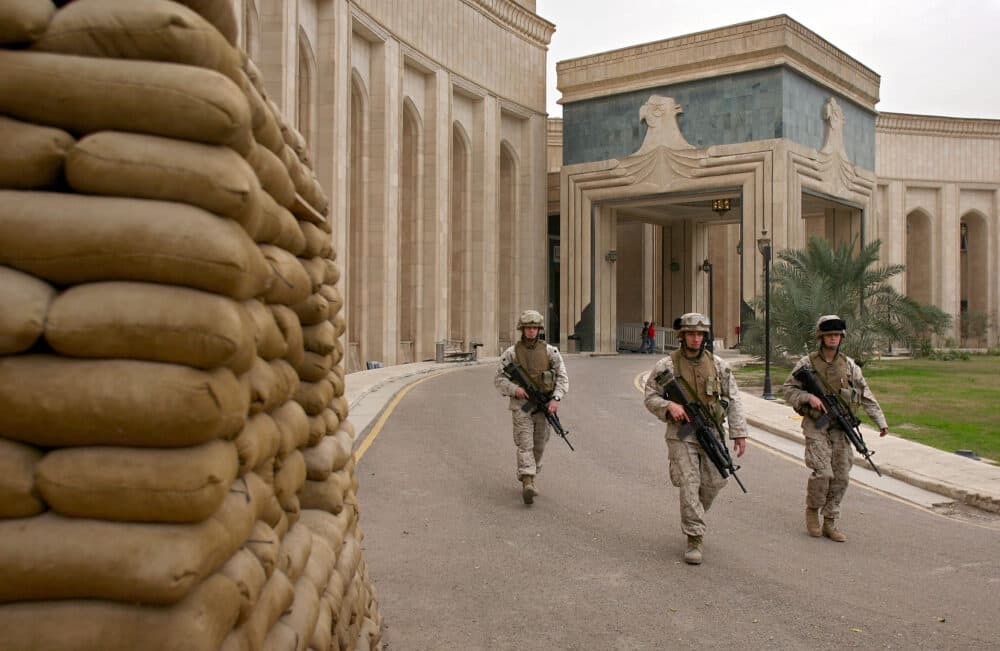 U.S. Marines walk past the front of the American Embassy Feb. 6, 2007 in Baghdad, Iraq. (John Moore/Getty Images)