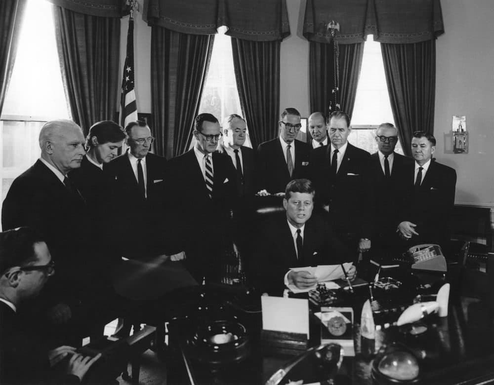 President John F. Kennedy (seated at desk) delivers remarks at the signing of the Drug Industry Act of 1962.  (Abbie Rowe. White House Photographs. John F. Kennedy Presidential Library and Museum, Boston)