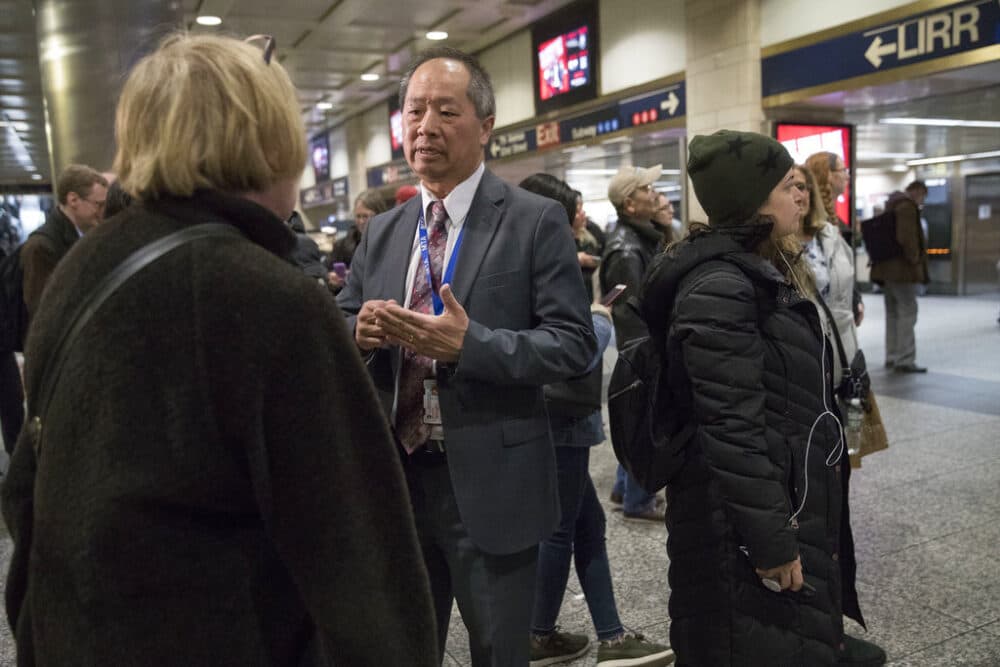 As president of the Long Island Rail Road, Phillip Eng, talks to evening rush hour commuters at Penn Station, April 17, 2018, in New York. (Mary Altaffer/AP)