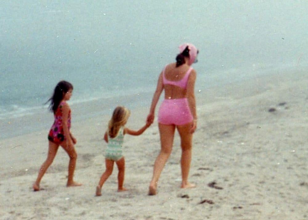 The author (middle) as a child, holding her mother's hand. Her sister, Lynn, walks beside her. (Courtesy Katherine A. Sherbrooke)