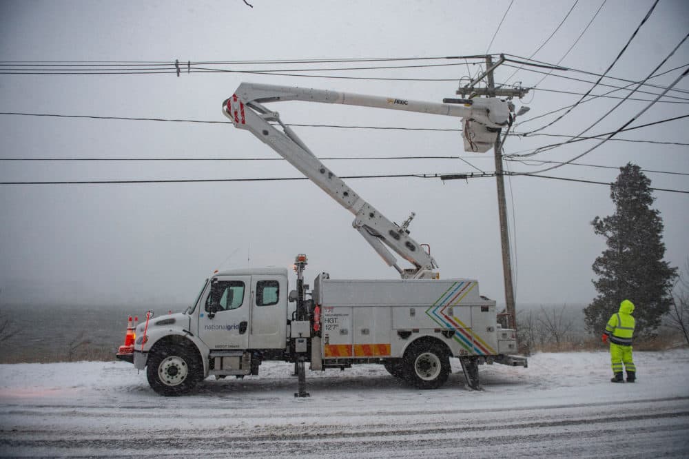 A electrical utility crew works on a power line during a nor'easter in Scituate in 2022. (Joseph Prezioso/AFP via Getty Images)