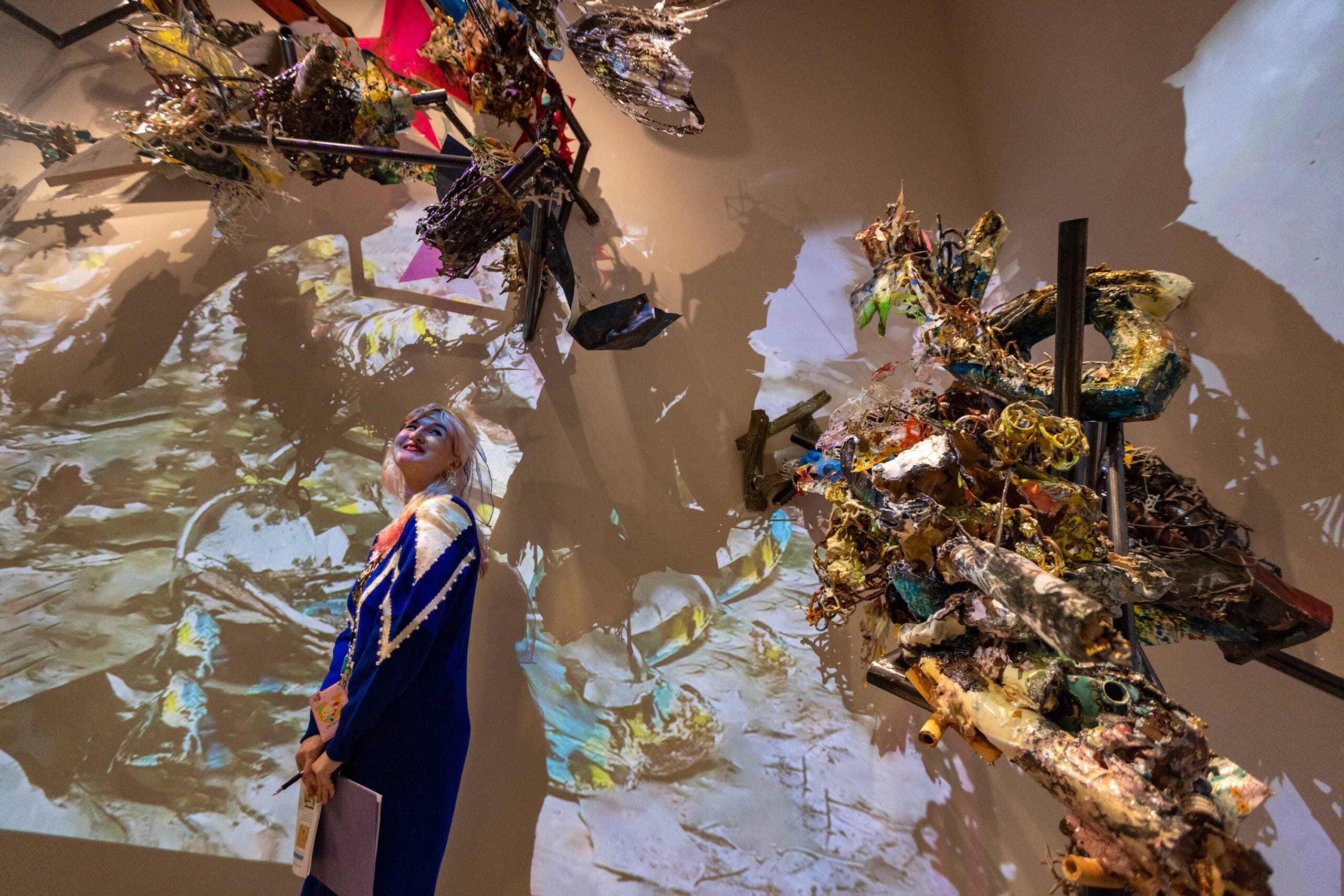 Kendall DeBoer, assistant curator of contemporary art at the MFA, walks through “Boru Sibaso Paet, on the foam of the primordial sea,” Linda Sormin’s interactive mixed-media installation at the &quot;Hokusai: Inspiration and Influence&quot; show. (Jesse Costa/WBUR)