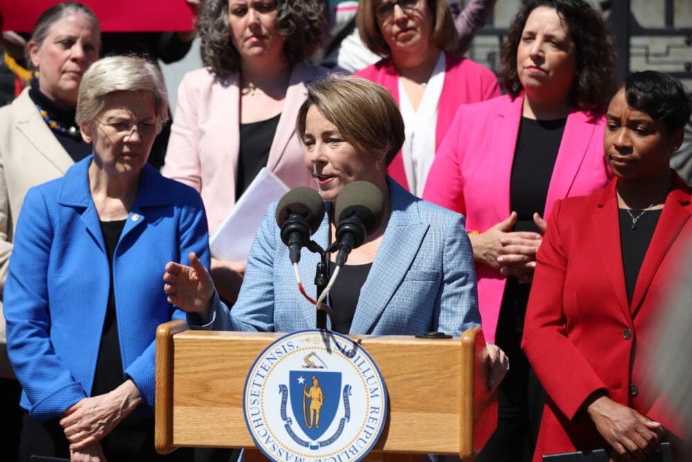 Gov. Maura Healey speaks to a crowd in front of the State House about protecting access to medication abortions in Massachusetts. (Sam Drysdale/State House News Service)