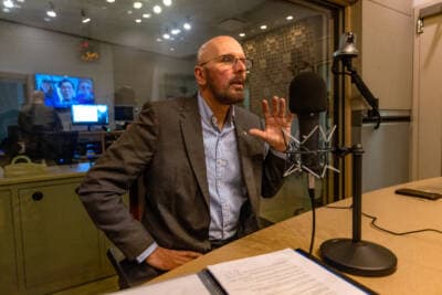 Dave Fortier, founder and president of One World Strong and a survivor of the 2013 Boston Marathon bombings, in the WBUR studios speaking with Rupa Shenoy. (Jesse Costa/WBUR)