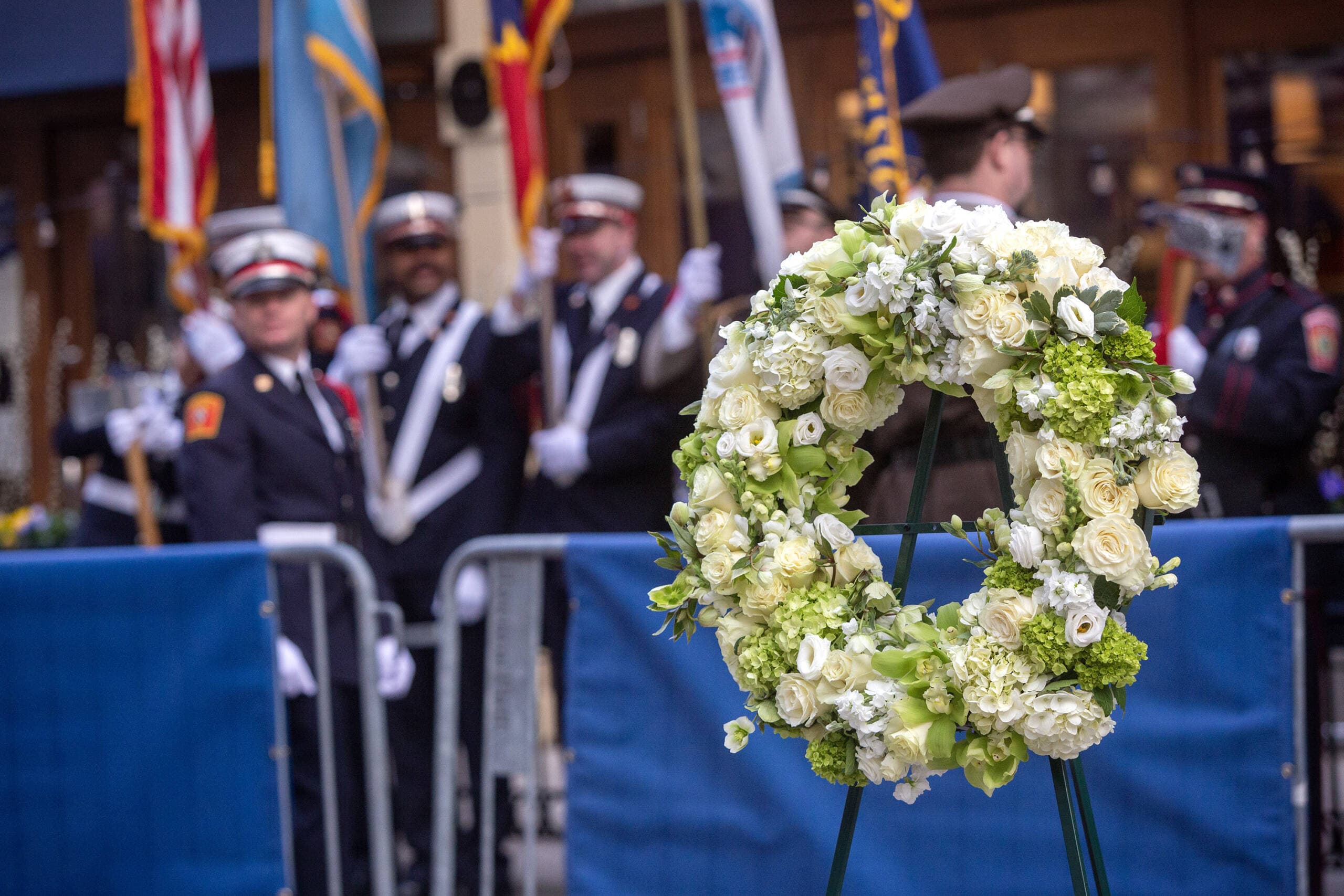 A memorial wreath on Boylston Street for a remembrance on the 10th anniversary of the 2013 Boston Marathon bombing. (Robin Lubbock/WBUR)