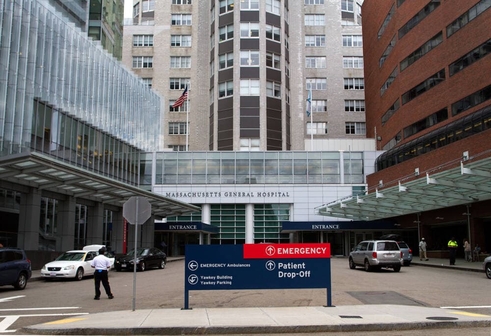 People walk near the entrance of Massachusetts General Hospital, pictured in 2018. (Bill Sikes/AP Photo)