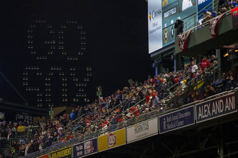 The words “Go Sox” are illuminated from the Prudential above the grandstands in Fenway Park. (Jesse Costa/WBUR)