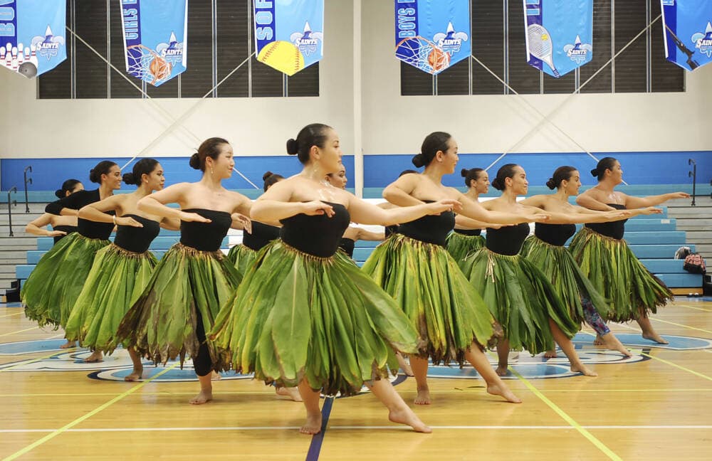 Members of Halau Hiiakainamakalehua practice in Honolulu for the upcoming Merrie Monarch Festival, which is the world's most prestigious hula competition. (Jennifer Sinco Kelleher/AP)