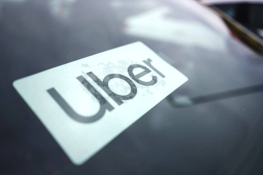 An Uber sign is displayed inside a car. (Nam Y. Huh/AP)