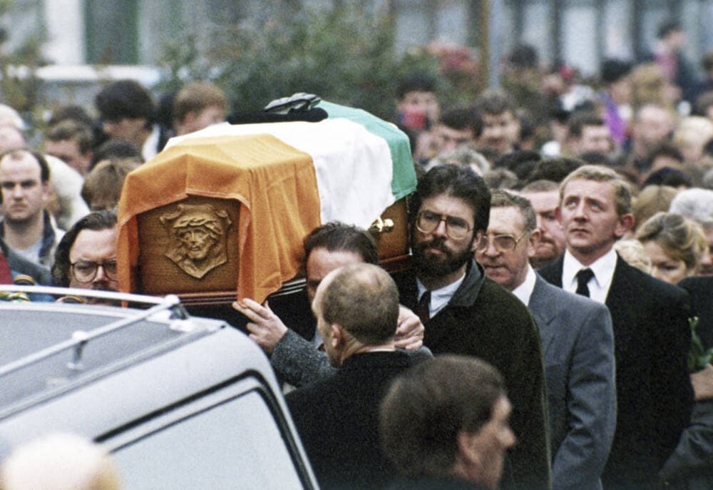 President of the Sinn Fein, Gerry Adams helps to carry the coffin of IRA member Thomas Begley, through the Ardoyne area of Belfast, Northern Ireland on Oct. 27, 1993. (AP)