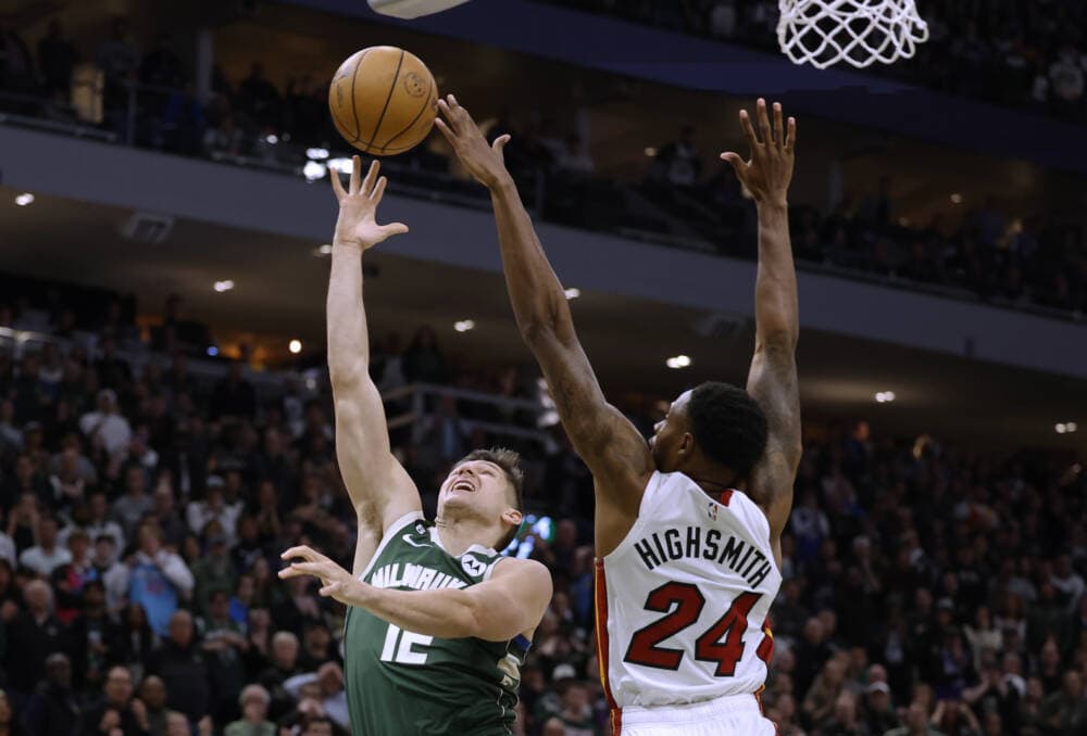 Milwaukee Bucks guard Grayson Allen (12) shoots against Miami Heat forward Haywood Highsmith (24) during overtime in Game 5 of an first-round NBA basketball playoffs. (Jeffrey Phelps/AP)