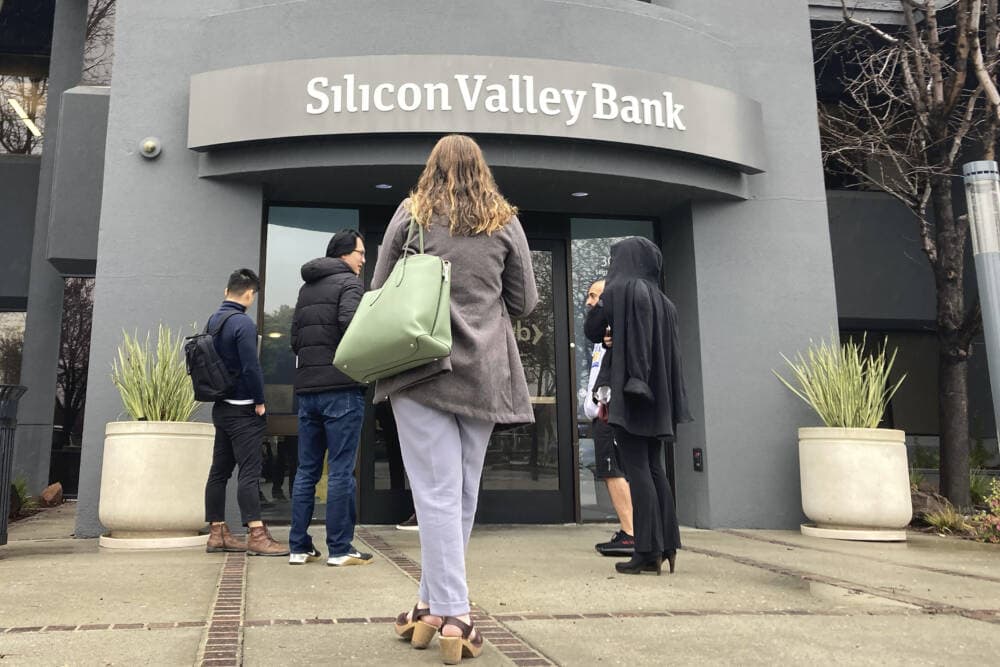 People stand outside a Silicon Valley Bank branch in Santa Clara, Calif., March 10, 2023. 
(Jeff Chiu/AP)