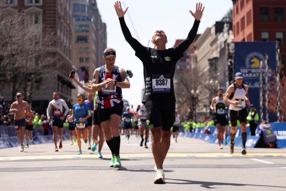Rodrigo Ronzella celebrates after crossing the finish line during the 126th Boston Marathon on April 18, 2022 in Boston, Massachusetts. (Maddie Meyer/Getty Images)