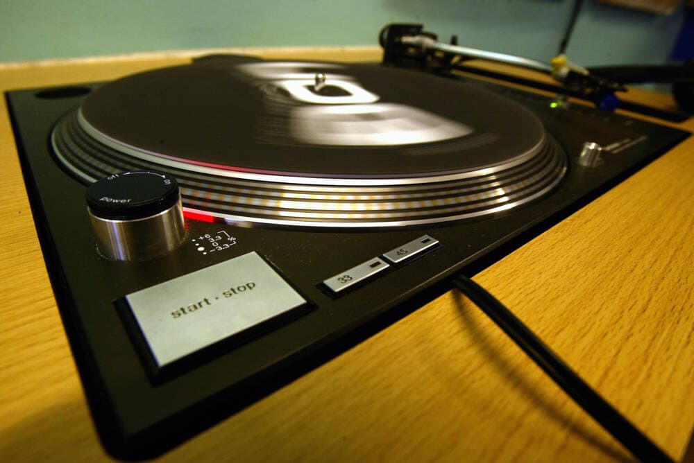 A turntable spins in a record shop in London. (Bruno Vincent/Getty Images)