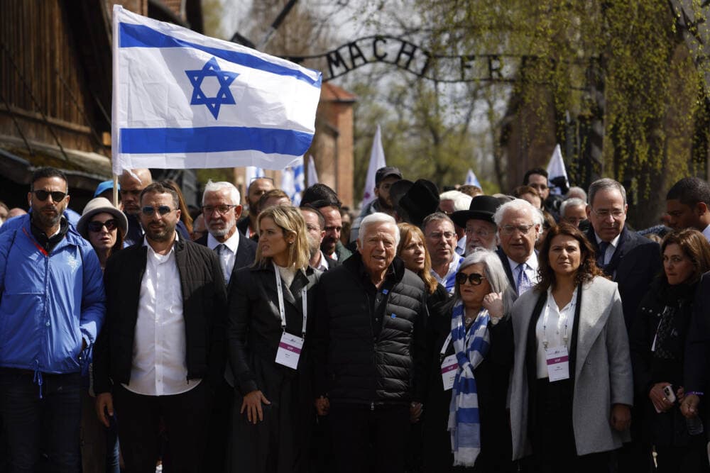 New England Patriots owner, Robert Kraft, front center, participates in the annual &quot;March of the Living,&quot; a trek between two former Nazi-run death camps, in Oswiecim, Poland, April 18, to mourn victims of the Holocaust and celebrate the existence of the Jewish state. (Michal Dyjuk/AP)