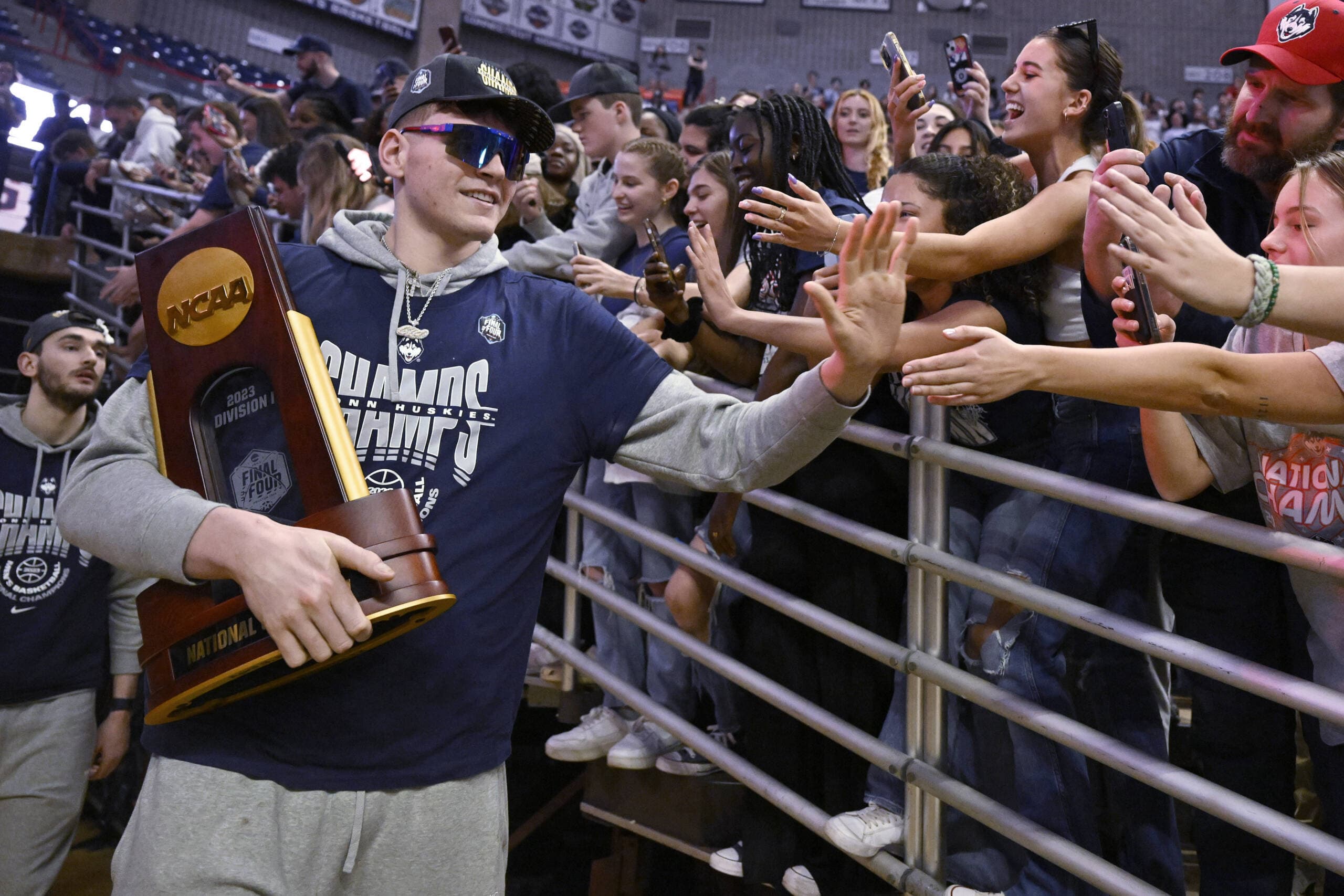 UConn's Donovan Clingan is greeted by fans as the team arrives for a rally at Gampel Pavilion in honor of UConn's NCAA men's Division I basketball championship, April 4, in Storrs, Conn. (Jessica Hill/AP)