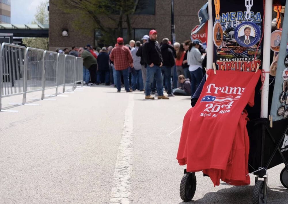 A merchandise vendor outside of the DoubleTree hotel in Manchester, where former President Donald Trump gave a campaign speech April 27. (Todd Bookman/NHPR)