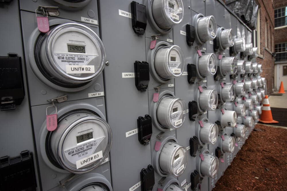 A wall of electricity meters at an apartment complex in Cambridge, Mass. (Robin Lubbock/WBUR)