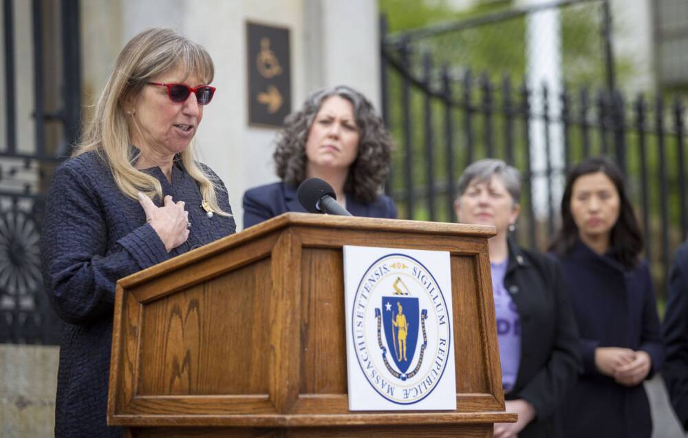 On the steps of the Massachusetts State House, Senate President Karen Spilka talks to the press. (Robin Lubbock/WBUR)