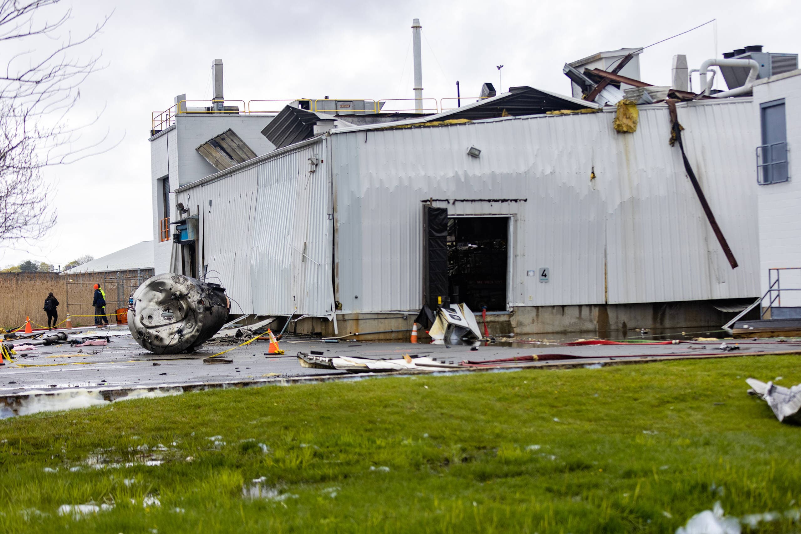 Debris scattered around the Seqens/PCI Synthesis pharmaceutical plant in Newburyport after a chemical explosion on Thursday, May 4. (Jesse Costa/WBUR)