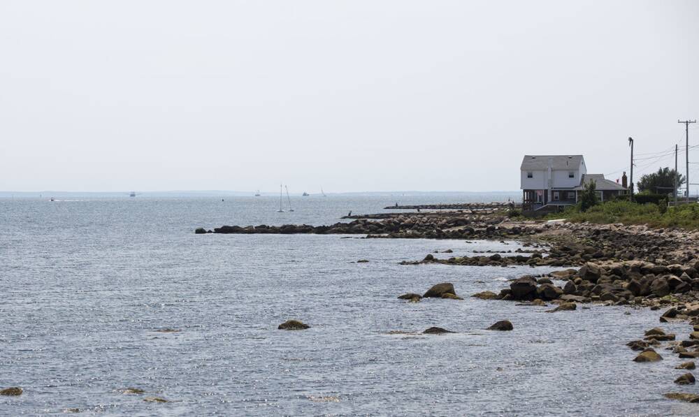 A house on the rocky north end of East Beach in New Bedford overlooking Buzzards Bay. (Jesse Costa/WBUR)