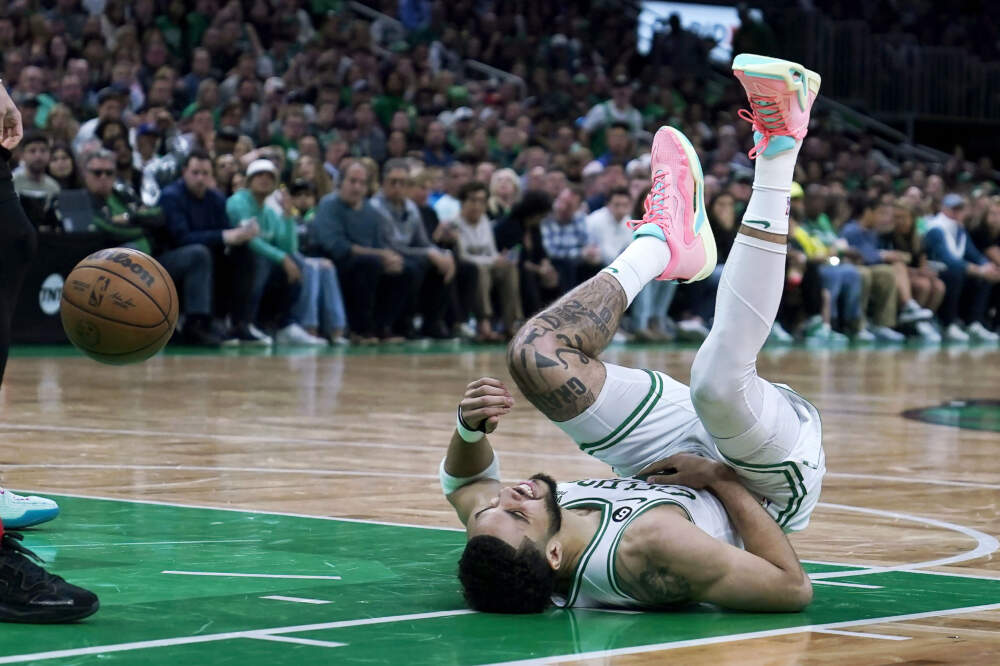 Boston Celtics forward Jayson Tatum reacts on the floor during the second half of Game 2 of the NBA basketball playoffs Eastern Conference finals against the Miami Heat in Boston, Friday, May 19, 2023. (Charles Krupa/AP)