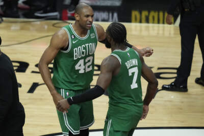 Boston Celtics center Al Horford (42) and forward Jaylen Brown (7) celebrate after the Celtics beat the Miami Heat 104-103 during Game 6 of the NBA basketball Eastern Conference finals, May 27 in Miami. (Rebecca Blackwell/AP)