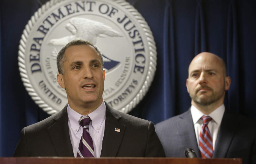 FBI Special Agent in Charge Boston Division Joseph Bonavolonta, left, and former U.S. Attorney for District of Massachusetts Andrew Lelling, right, face reporters as they announce indictments in a sweeping college admissions bribery scandal during a news conference on March 12, 2019, in Boston. (Steven Senne/AP)