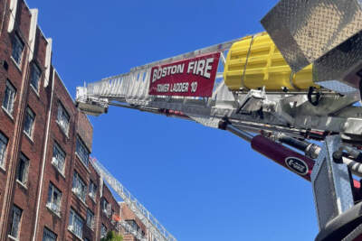 Several Boston Fire Department ladder trucks were on the scene at a three-alarm blaze in Brighton. (Photo courtesy Boston Fire Department)