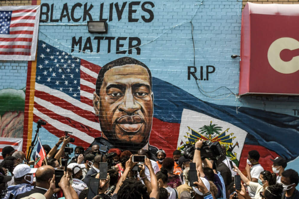 A mural painted by artist Kenny Altidor depicting George Floyd is unveiled on a sidewall of CTown Supermarket on July 13, 2020 in the Brooklyn borough New York City.   (Stephanie Keith/Getty Images)