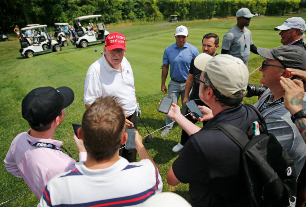 BEDMINSTER, NEW JERSEY - JULY 28: Former U.S. President Donald Trump talks with media and fans on the sixth hole during the pro-am prior to the LIV Golf Invitational - Bedminster at Trump National Golf Club Bedminster on July 28, 2022 in Bedminster, New Jersey. (Photo by Jonathan Ferrey/LIV Golf via Getty Images)