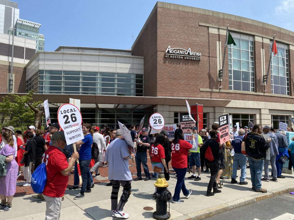 Screenwriters and WGA union members protested Boston University's commencement ceremony, which invited Warner Bros. president and CEO David Zaslav to speak. (Walter Wuthmann/WBUR)