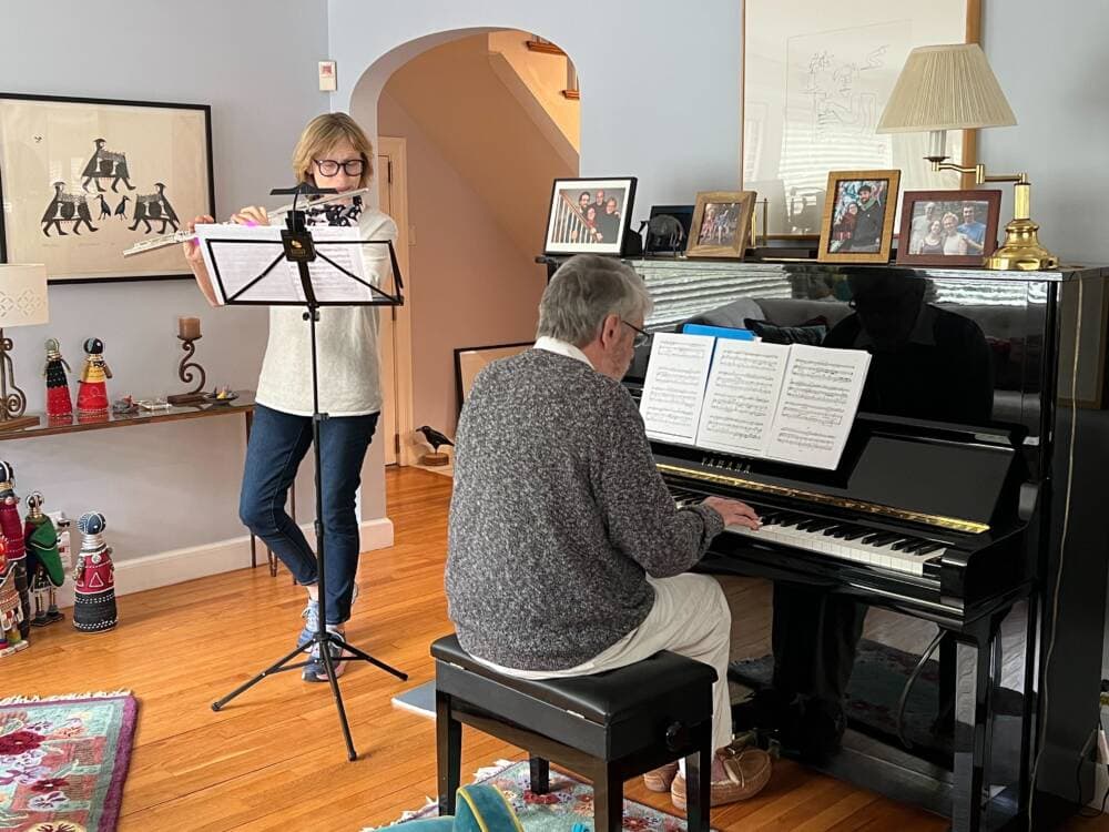 Pianist Bruce Vogt and flautist Thomasine Berg rehearse for an upcoming concert at the Jewish Community Center of Greater Boston. (Cristela Guerra/WBUR)