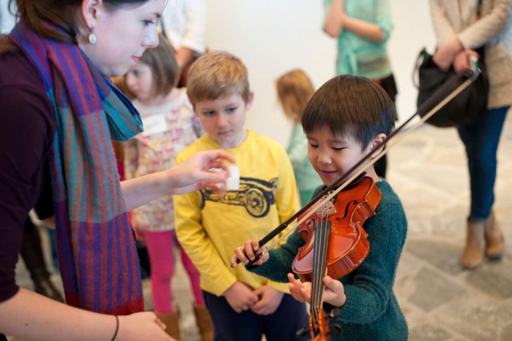 Children play at the Chameleon Art Ensemble's Instrument Petting Zoo. (Courtesy Ashworth Photography)