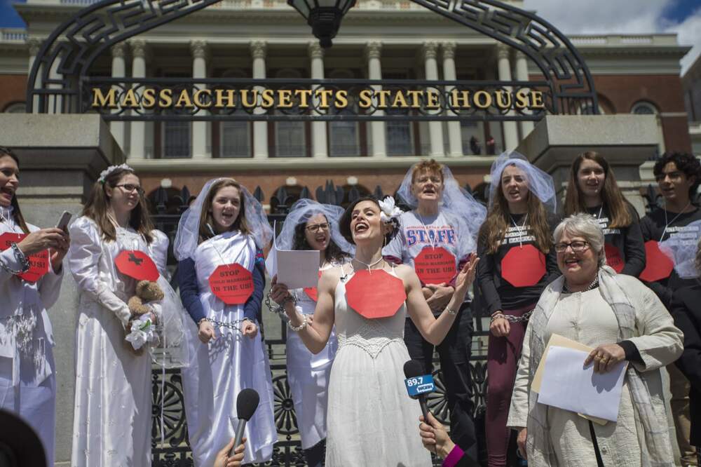 Protesters chant outside the State House during a rally to end child marriage and set minimum age at 18 in Massachusetts. (Jesse Costa/WBUR)