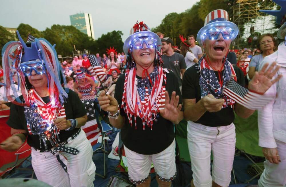 Spectators applaud during rehearsal for the annual Boston Pops orchestra Fourth of July concert at the Hatch Shell in Boston, Friday, July 3, 2015. (Michael Dwyer/ AP)