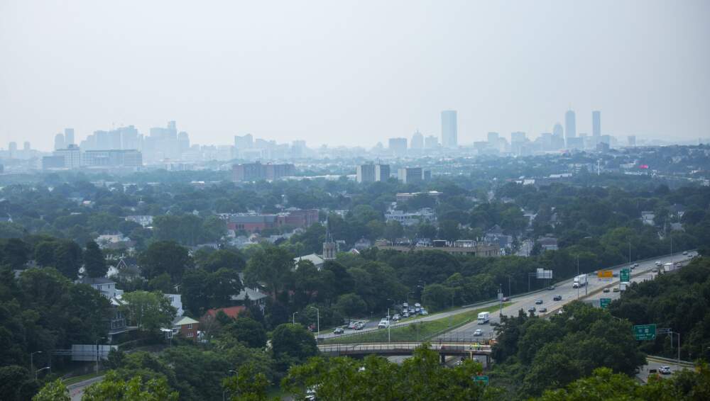 A view of the Boston skyline from Wright’s Tower in Medford on July 21, 2021. Over the last several days, haze has permeated the city due to smoke traveling from wildfires in the western part of the country and Canada. (Jesse Costa/WBUR)