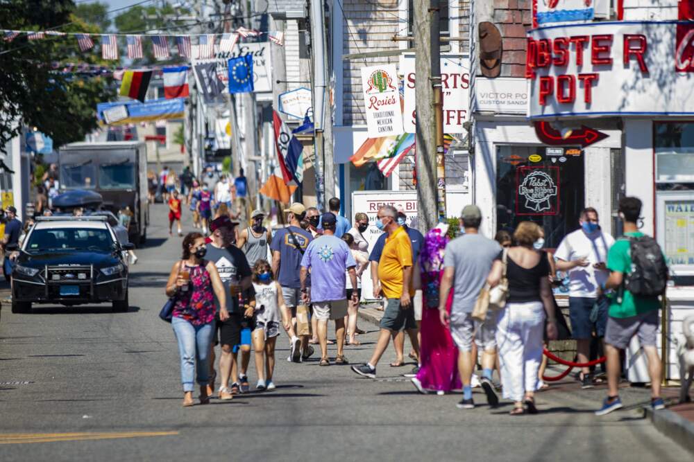 Tourists walk along Commercial Street in Provincetown. (Jesse Costa/WBUR)