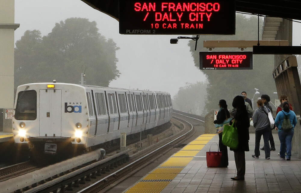 Bay Area Rapid Transit (BART) passengers wait for a train in Oakland, Calif. (Ben Margot/AP)