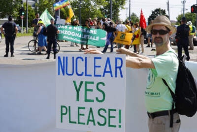 A pro-nuclear activist demonstrates outside the European Parliament July 6, 2022 in Strasbourg, eastern France. (Jean-Francois Badias/AP)