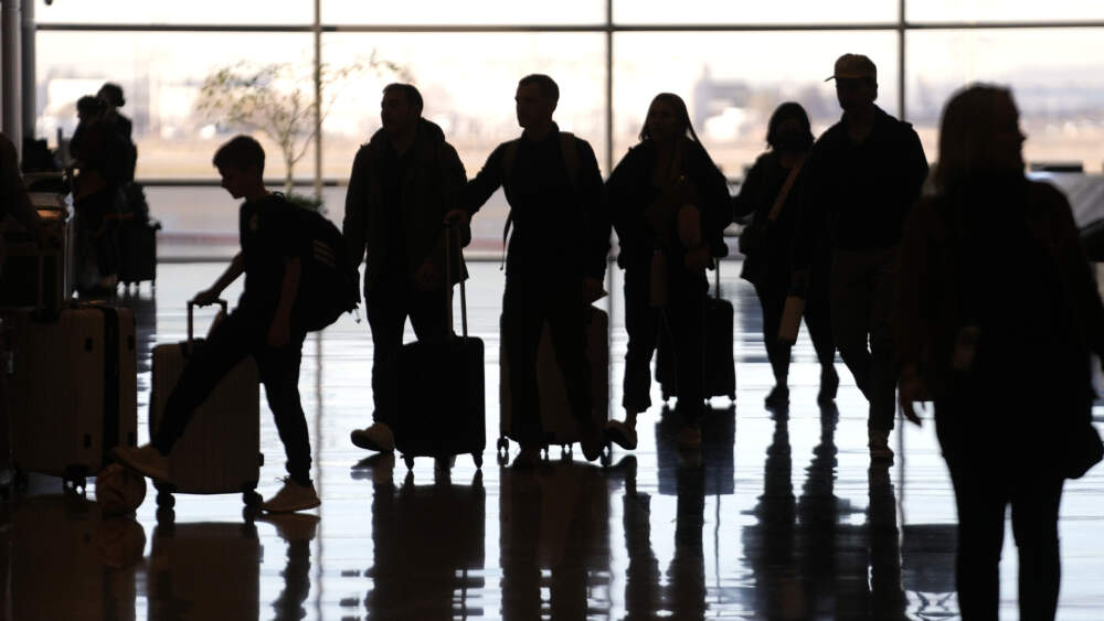 People pass through Salt Lake City International Airport. (Rick Bowmer/AP)
