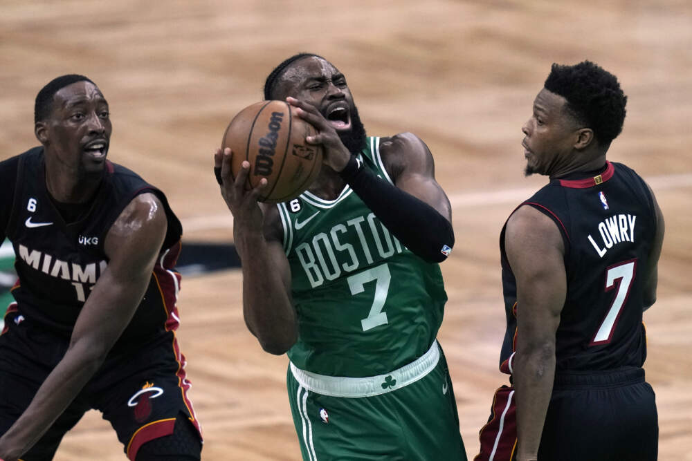 Boston Celtics guard Jaylen Brown, center, shoots as Miami Heat center Bam Adebayo left, and guard Kyle Lowry defend during the first half in Game 7 of the NBA basketball Eastern Conference finals Monday, May 29, 2023, in Boston. (Charles Krupa/AP)