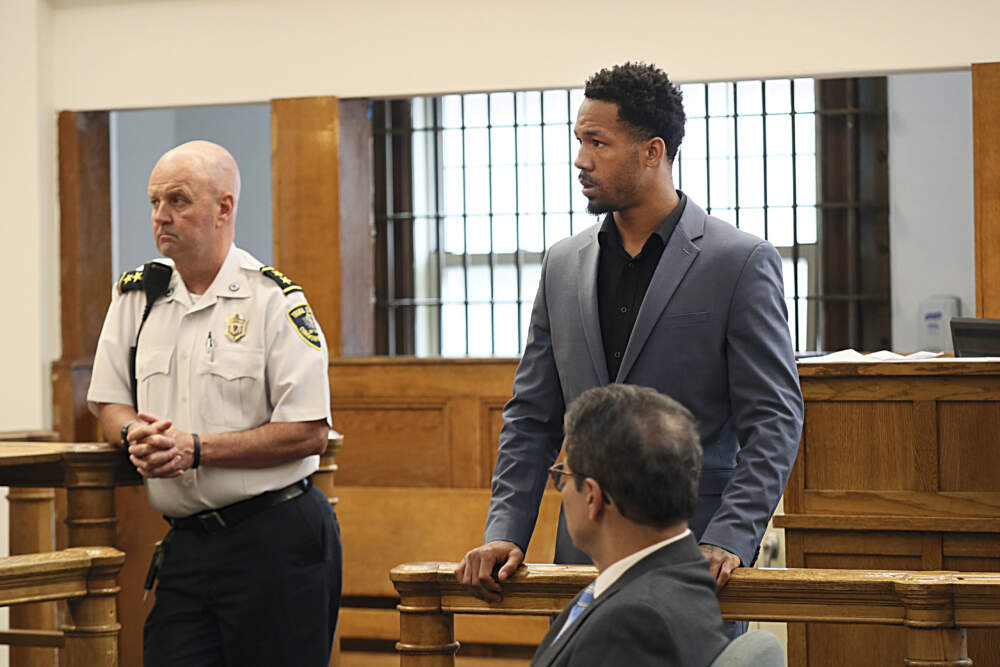 New England Patriots cornerback Jack Jones, rear right, is shown at his arraignment on gun charges at East Boston Municipal Court. (Suzanne Kreiter/The Boston Globe via AP, Pool)