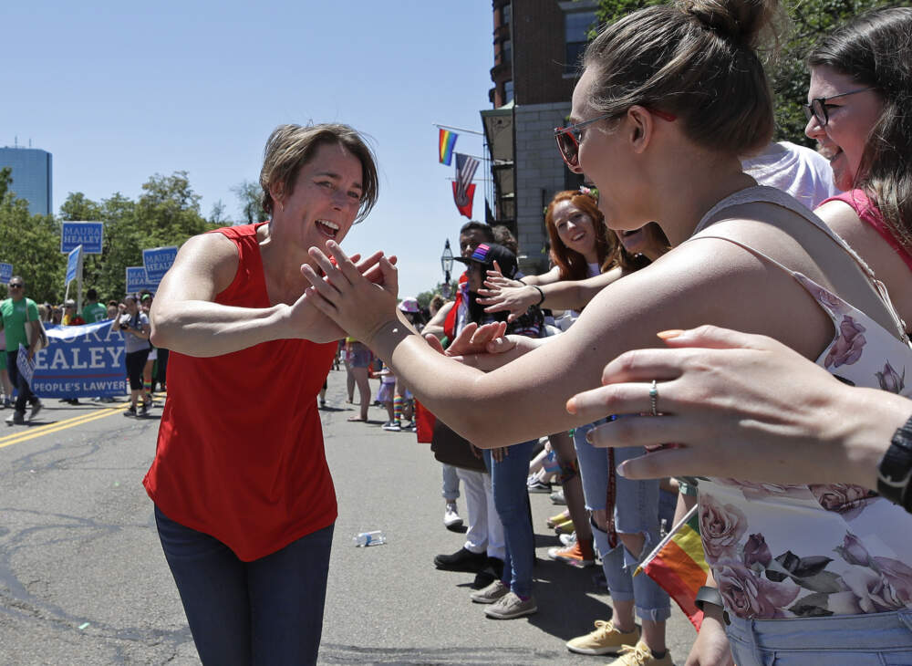 Massachusetts Gov. Maura Healey (then the state's attorney general) greets onlookers during the 2019 Pride Parade in Boston. (Elise Amendola/AP Photo)