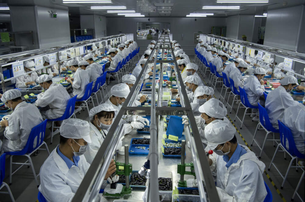 Workers make pods for e-cigarettes on the production line at Kanger Tech, one of China's leading manufacturers of vaping products, on September 24, 2019 in Shenzhen, China. (Kevin Frayer/Getty Images)