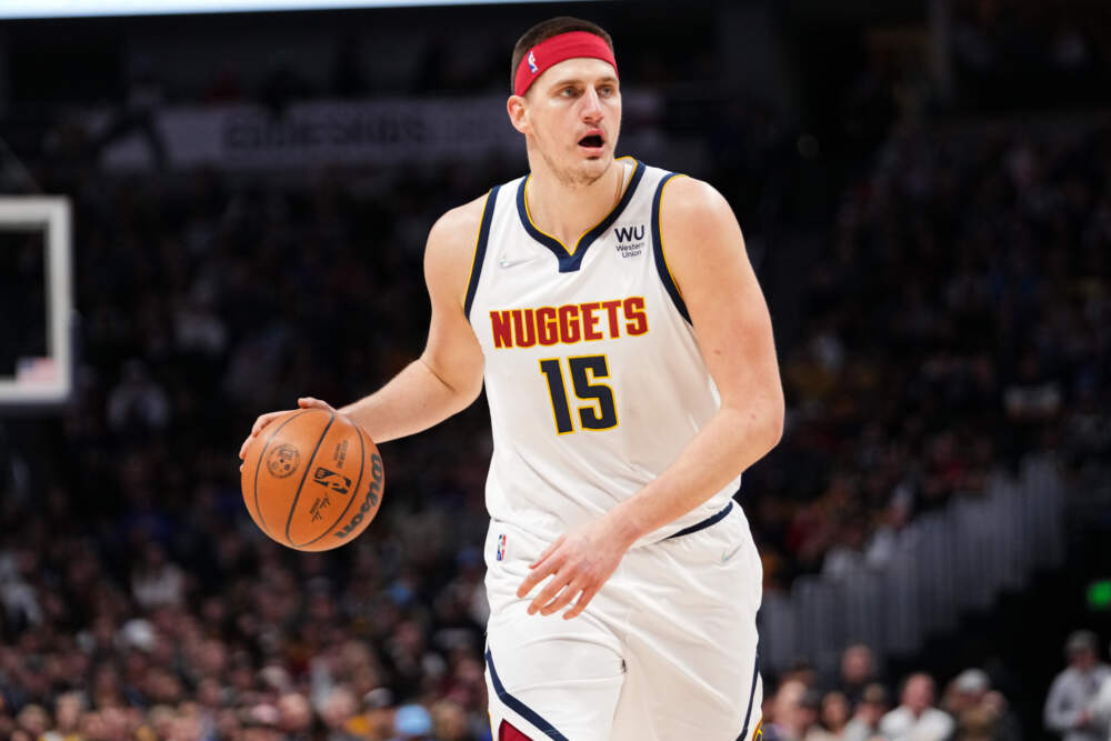 Nikola Jokic #15 of the Denver Nuggets dribbles against the Memphis Grizzlies at Ball Arena on April 7, 2022 in Denver, Colorado. (Ethan Mito/Clarkson Creative/Getty Images)