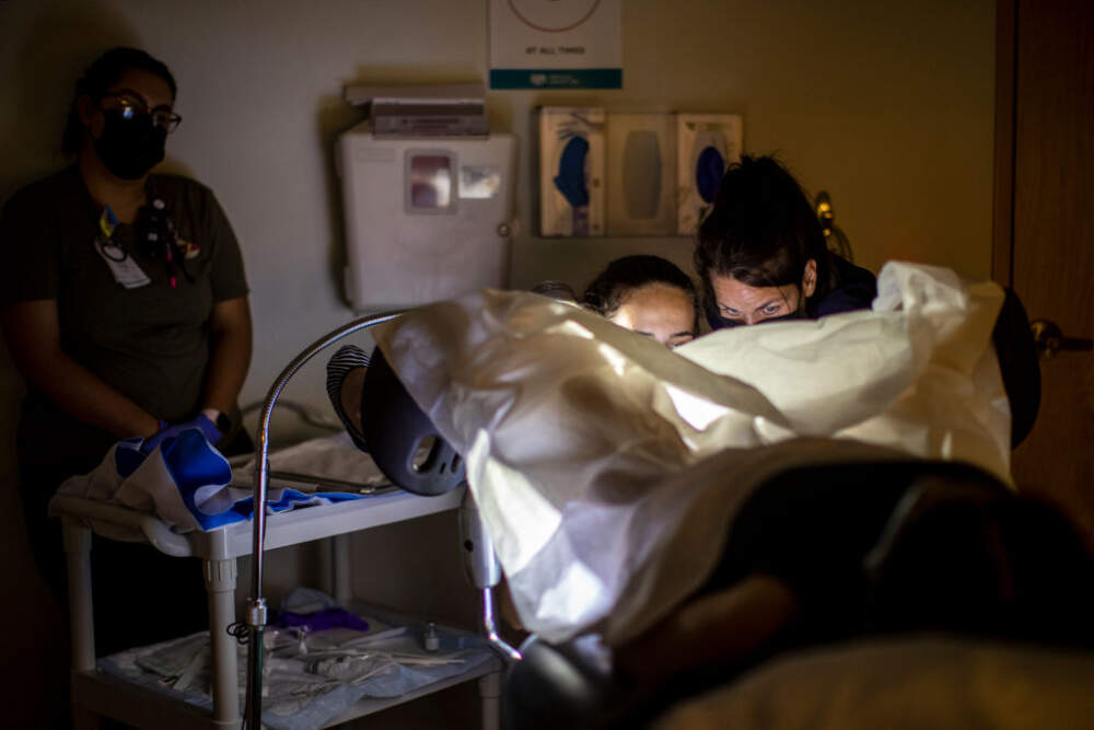 A family physician, right, and her resident perform a surgical abortion on a 39-year-old woman who already has four children the day before the Supreme Court overturned Roe v. Wade at the Center for Reproductive Health clinic on June 23, 2022 in Albuquerque, New Mexico. (Gina Ferazzi / Los Angeles Times via Getty Images)