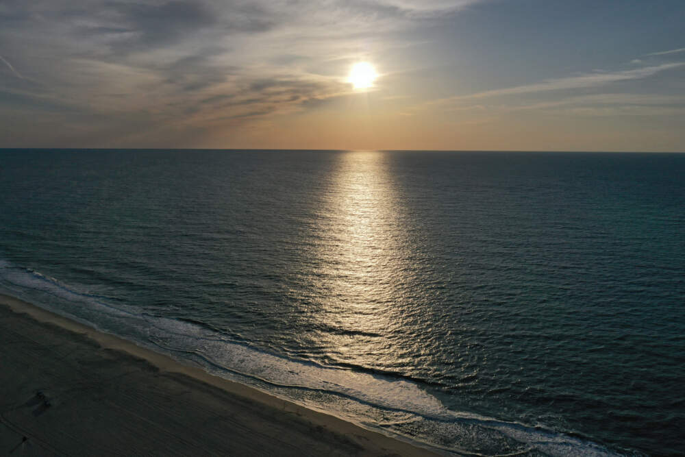 In an aerial view, the sunrises over the Atlantic Ocean on May 26, 2023 in Ocean City, Maryland. (Patrick Smith/Getty Images)